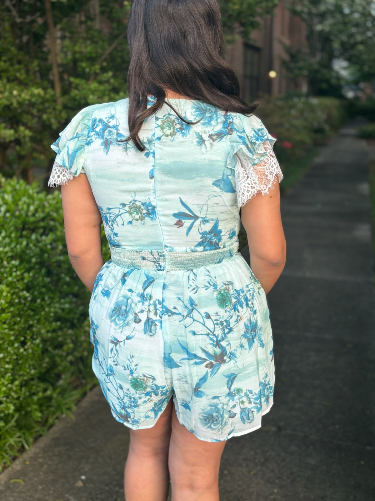 Emily - Short sleeve V-neck lace detailed floral romper